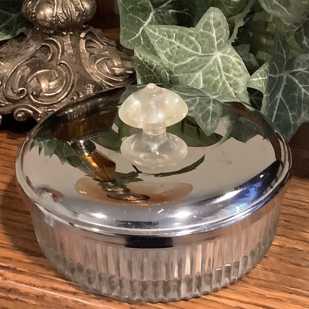 Vintage glass powder dish with chrome lid and Charlie puff
